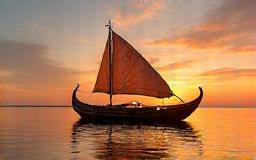 Traditional dhow boat at sunset